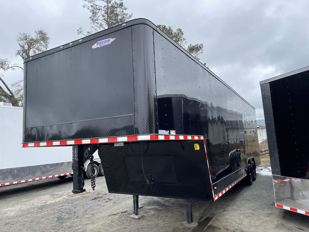 8.5′ x 32′ Loaded Black Freedom Cargo Gooseneck Trailer for Sale in Douglas, GA – $27,225